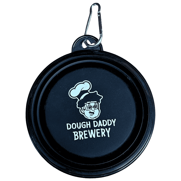 Black circular lid with "Dough Daddy Brewery" logo featuring a cartoon chef. Attached metal clip on top.