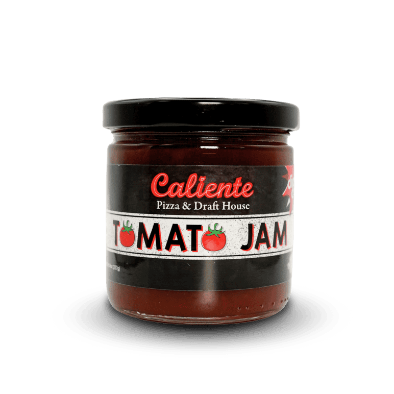 A jar of Caliente Tomato Jam with a black lid and a label featuring red and white text, along with images of tomatoes, brings the taste of Pittsburgh Pizza to your home.