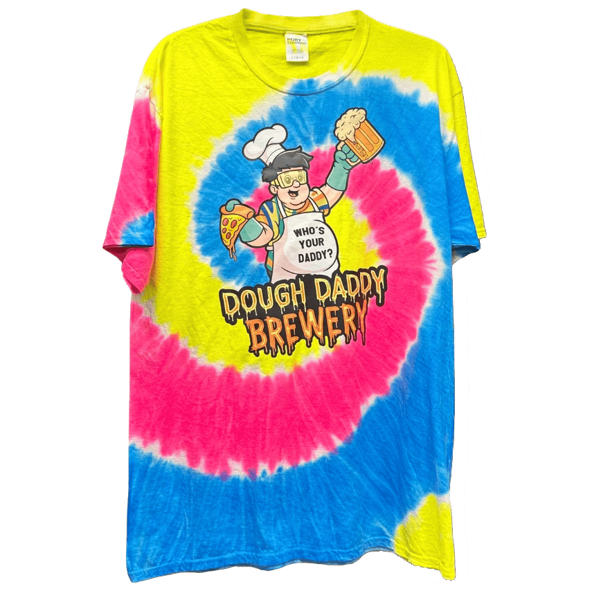 A tie-dye T-shirt with pink, yellow, and blue swirls featuring a cartoon chef holding a pizza and beer, text reads "Dough Daddy Brewery".