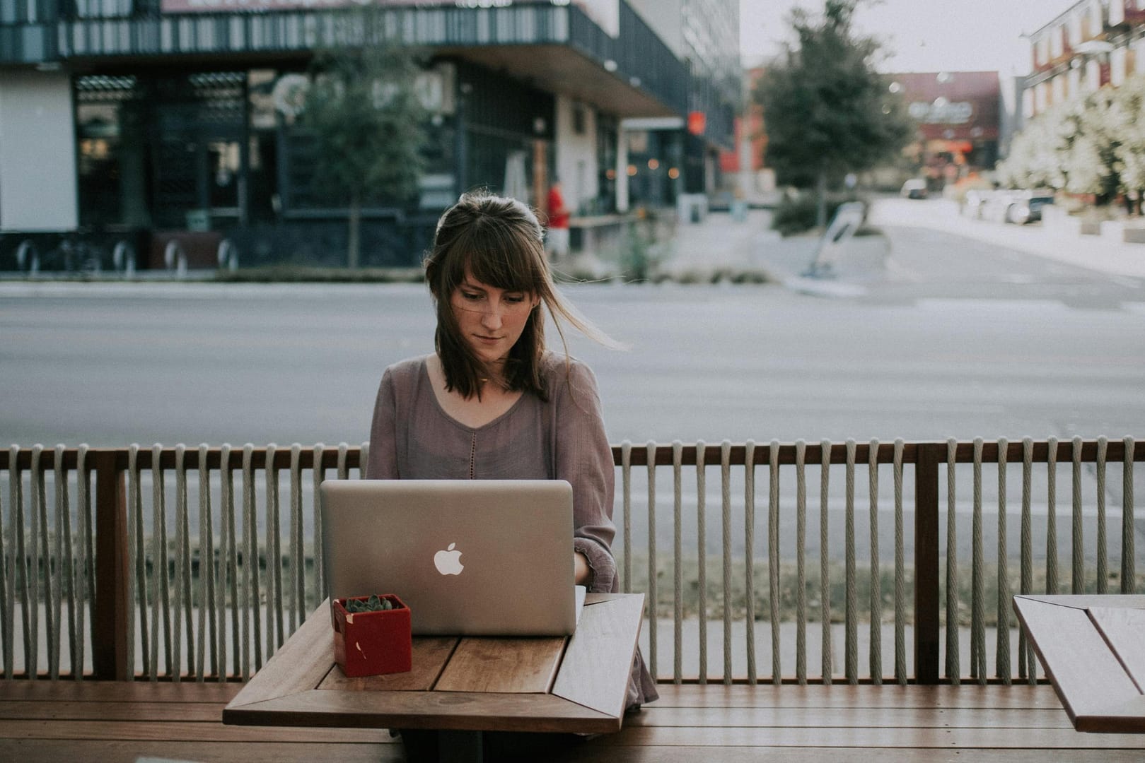 Woman on laptop at coffee shop