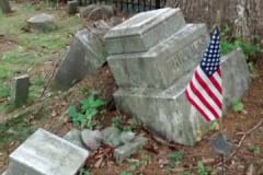broken headstone before
