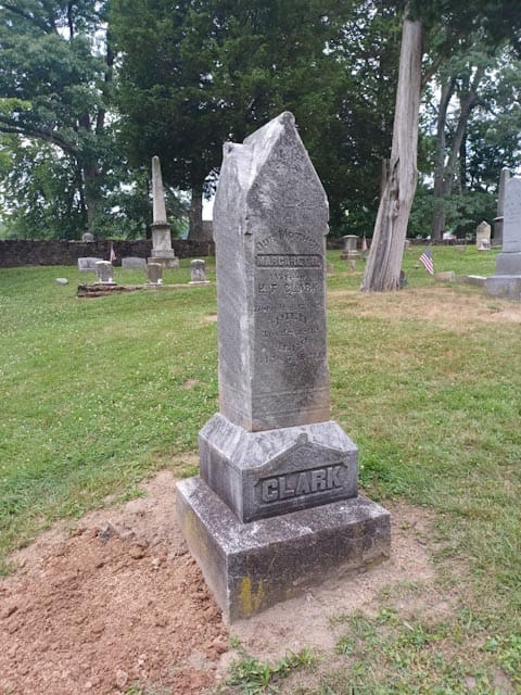 repaired cemetery monument before
