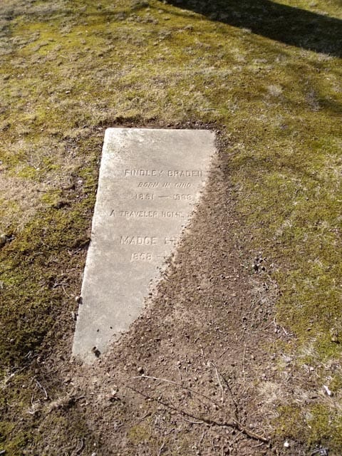 buried headstone before