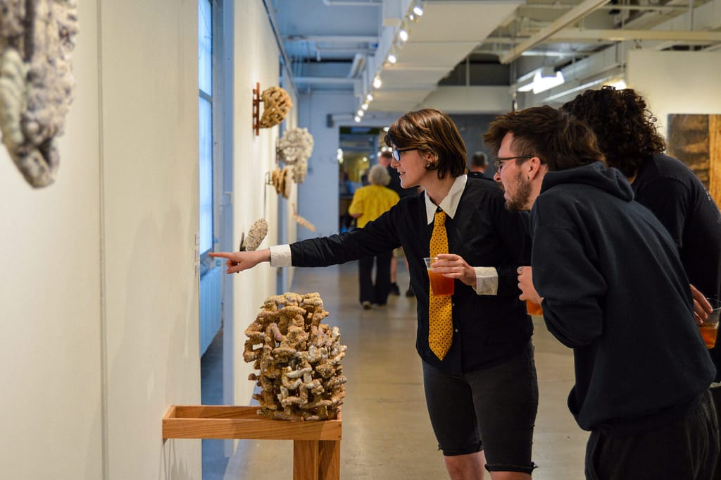Gallery reception people reaction viewing exhibition