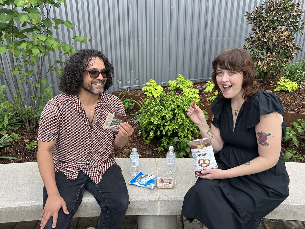 man and woman sharing snacks outside