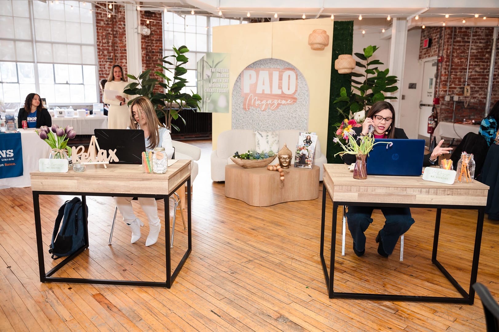 women working at desks during a private event