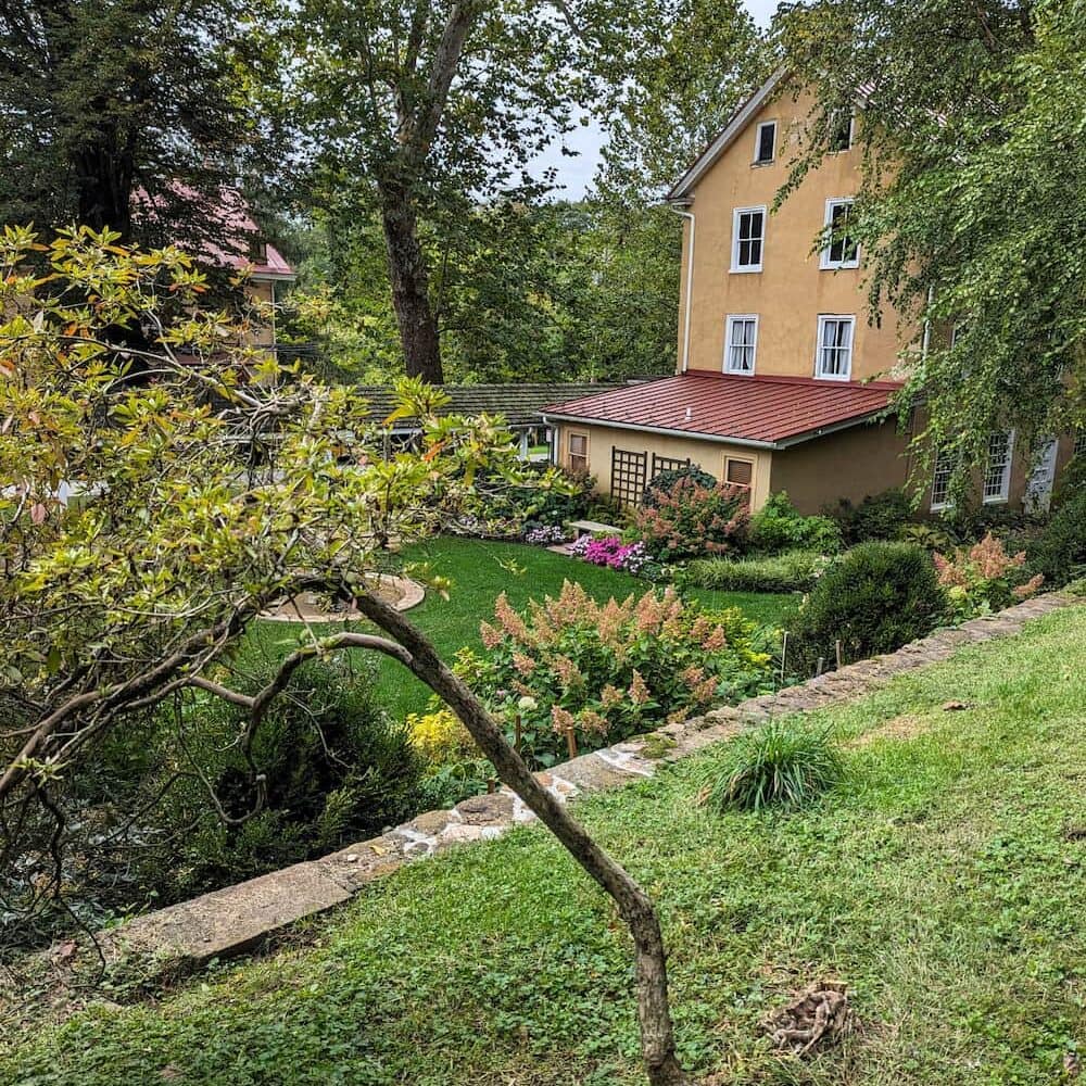 The portico walkway approaching the preserved historic Washington building, wedding venue, and courtyard gardens.