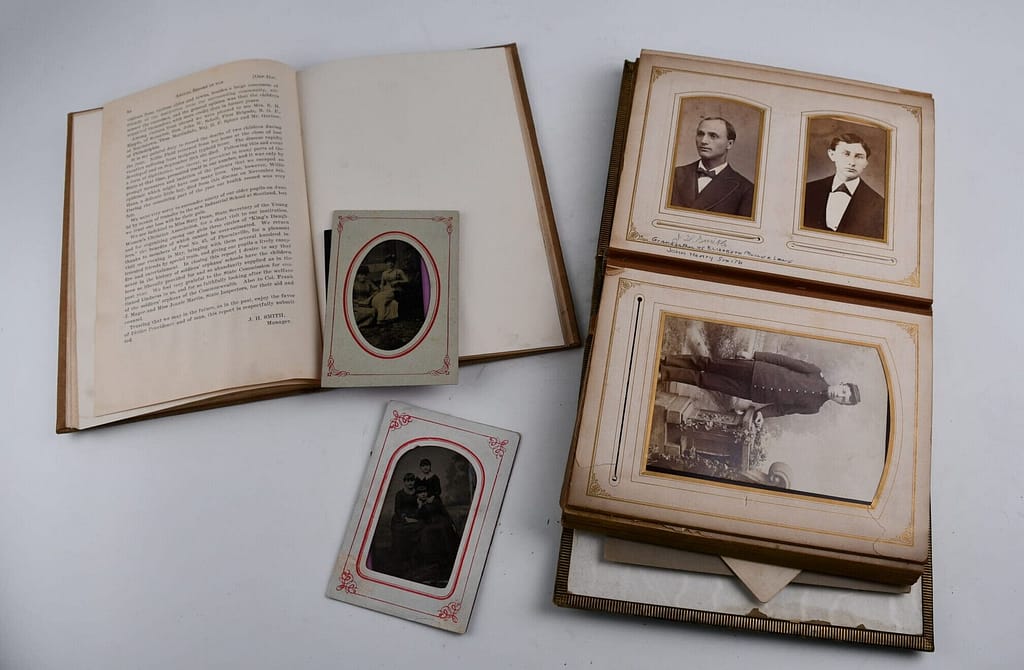 comparing a family photo album with records of the Orphan's School System to identify who is who