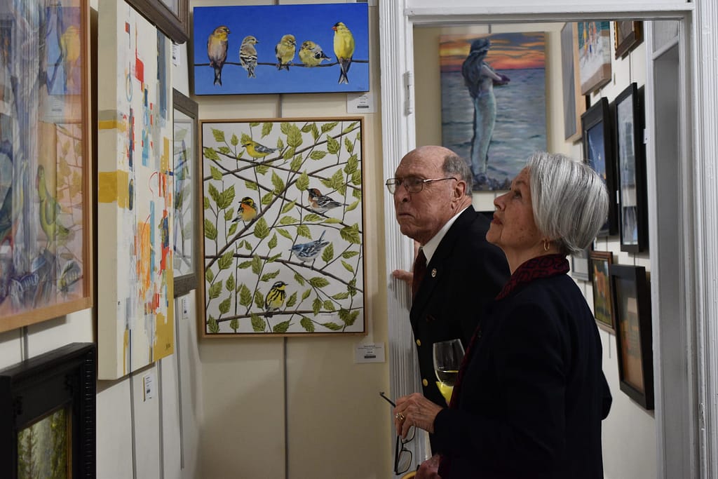 Community Visitors admire art work in the gallery at the Yellow Springs Art Show and sale