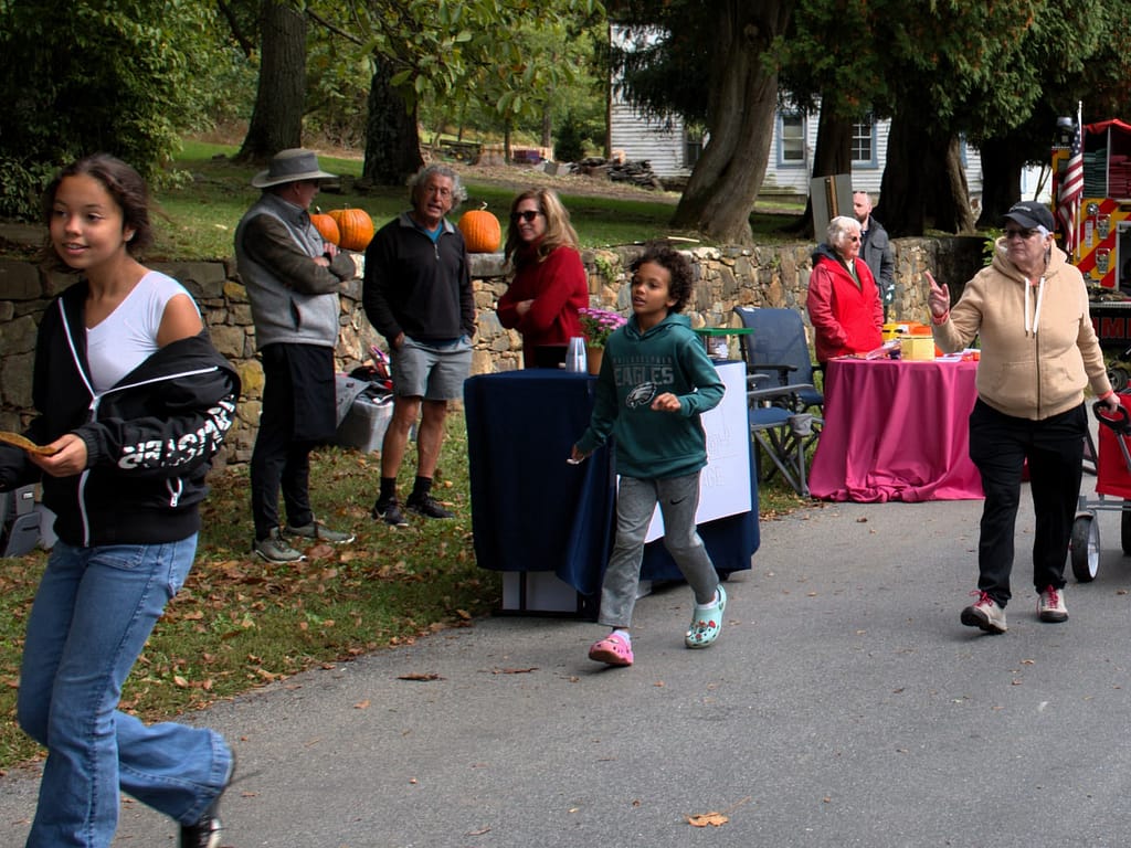 Youth Visitors explore the history while attending the community village open house event.