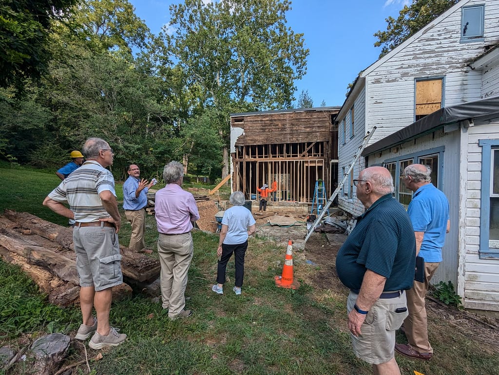 Board of directors views historic preservation in action with the restoration of a historic building