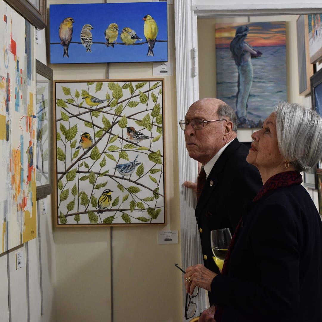 Community Visitors admire art work in the gallery at the Yellow Springs Art Show and sale