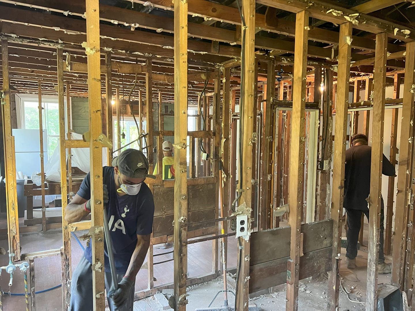 Opening up walls during exploratory demolition as part of the historic preservation project for the Connie's House restoration.