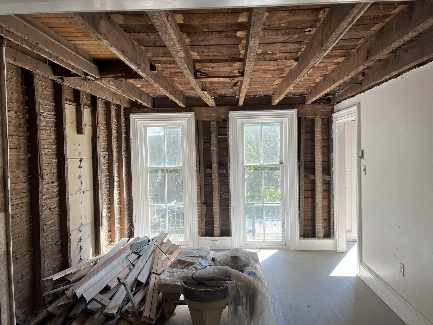 Opening up walls during exploratory demolition as part of the historic preservation project for the Connie's House restoration.