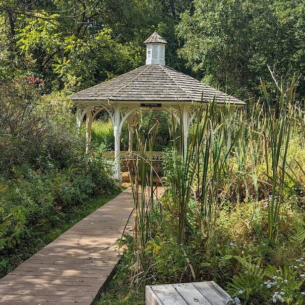 The walkway approaching the preserved historic yellow springs gazebo and gardens.