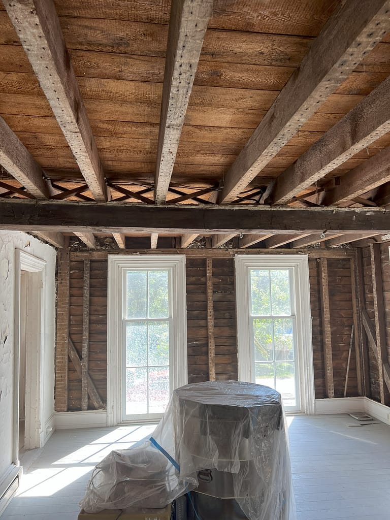 Opening up walls during exploratory demolition as part of the historic preservation project for the Connie's House restoration.
