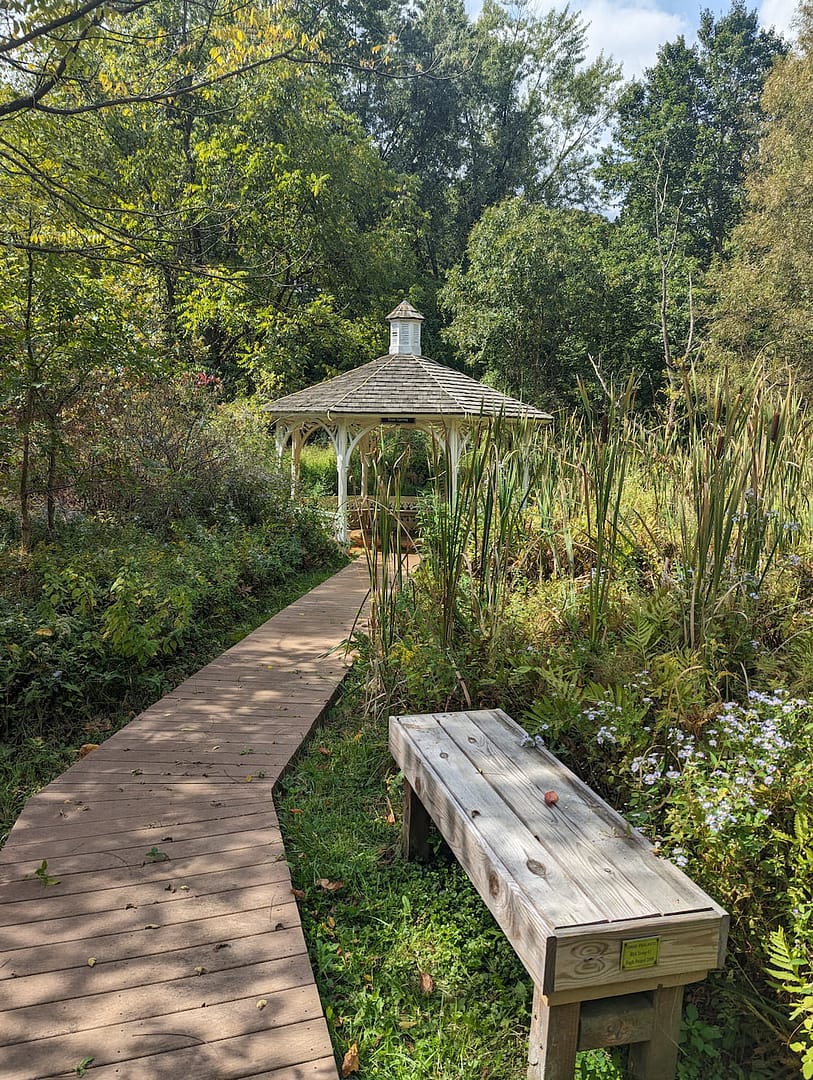 The walkway approaching the preserved historic yellow springs gazebo and gardens.